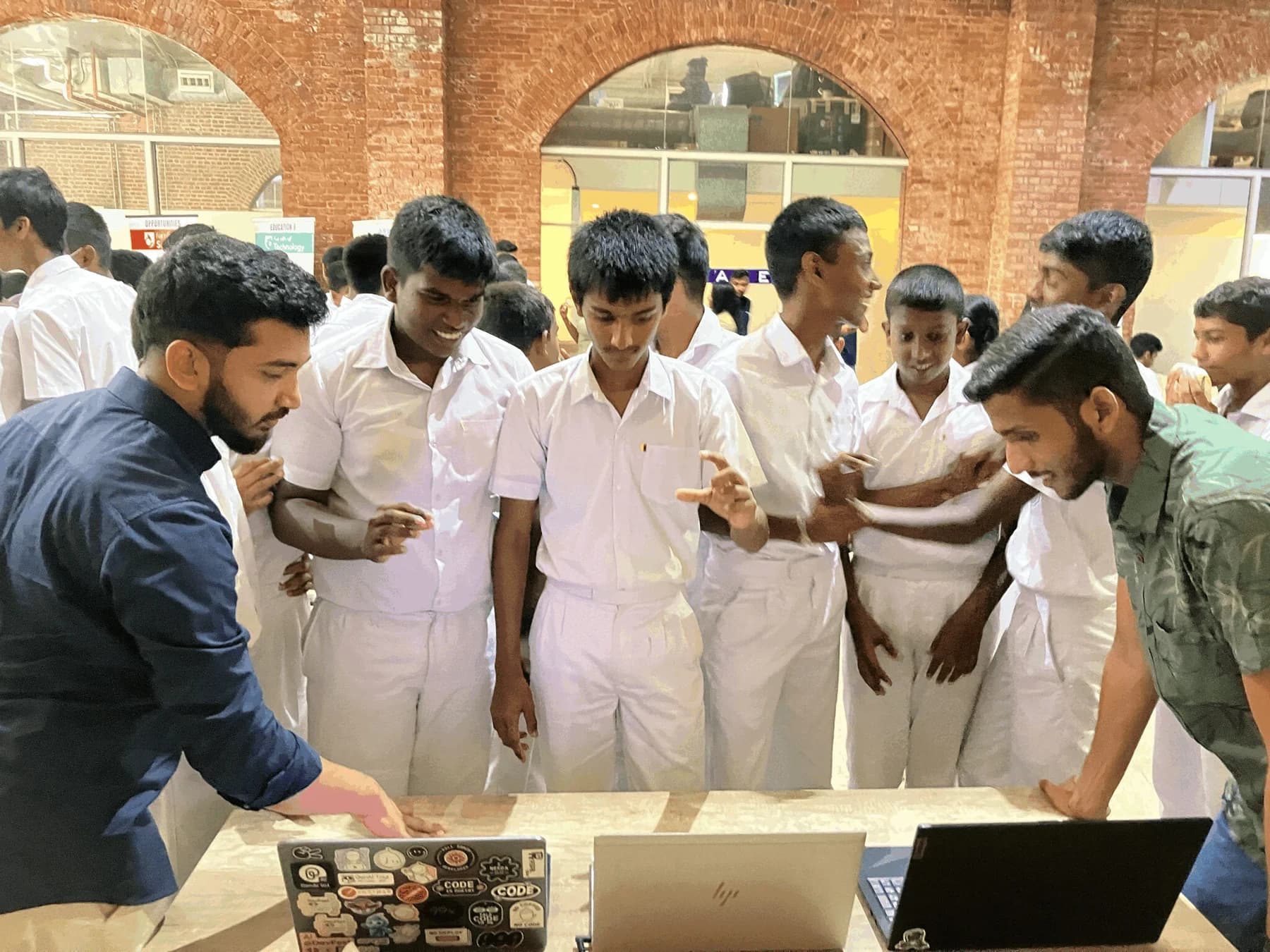MoveMate team showing the camera-based rehabilitation prototype to visitors at an exhibition