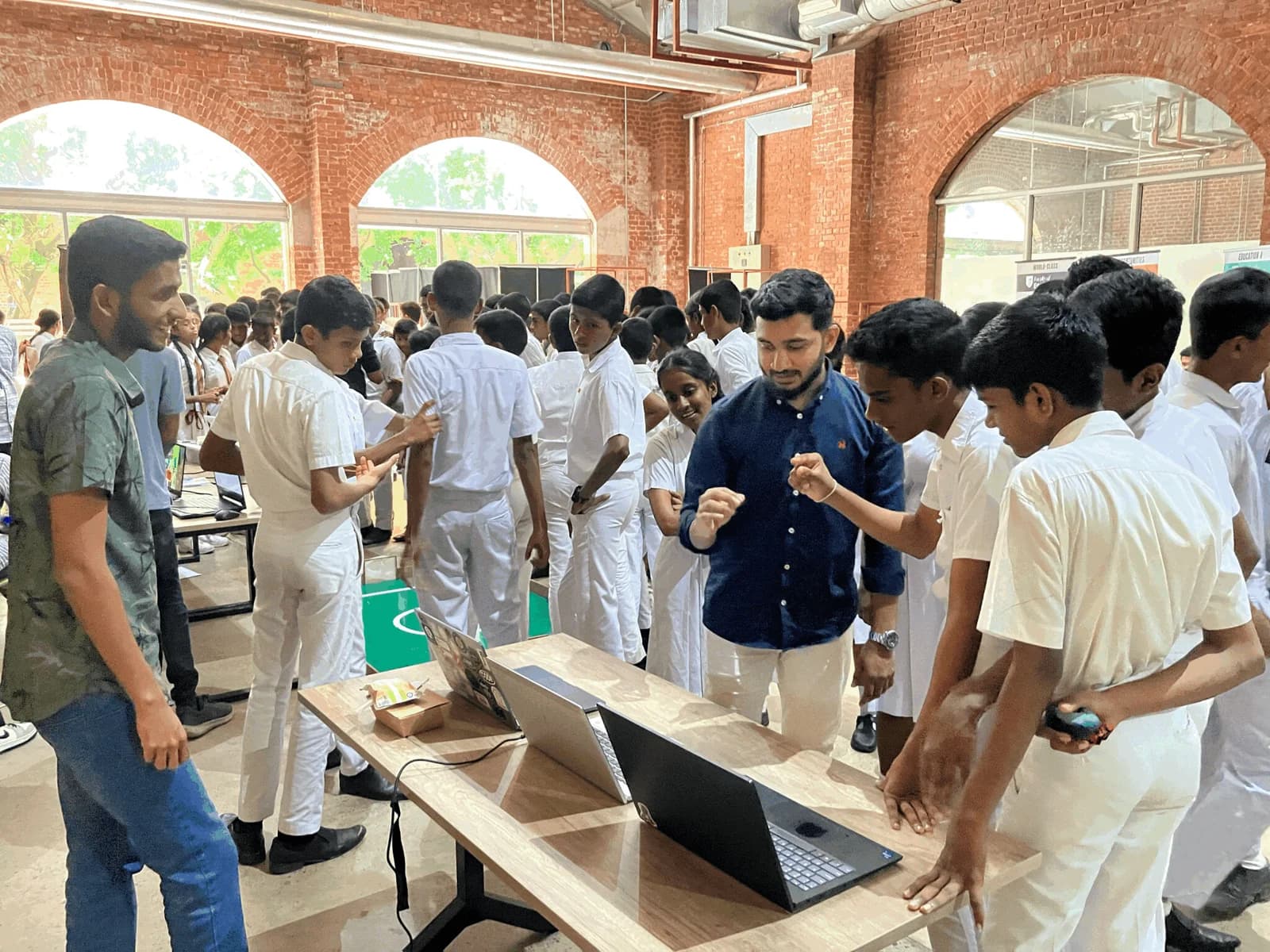 MoveMate demonstration: the team showing camera-based interaction to exhibition visitors