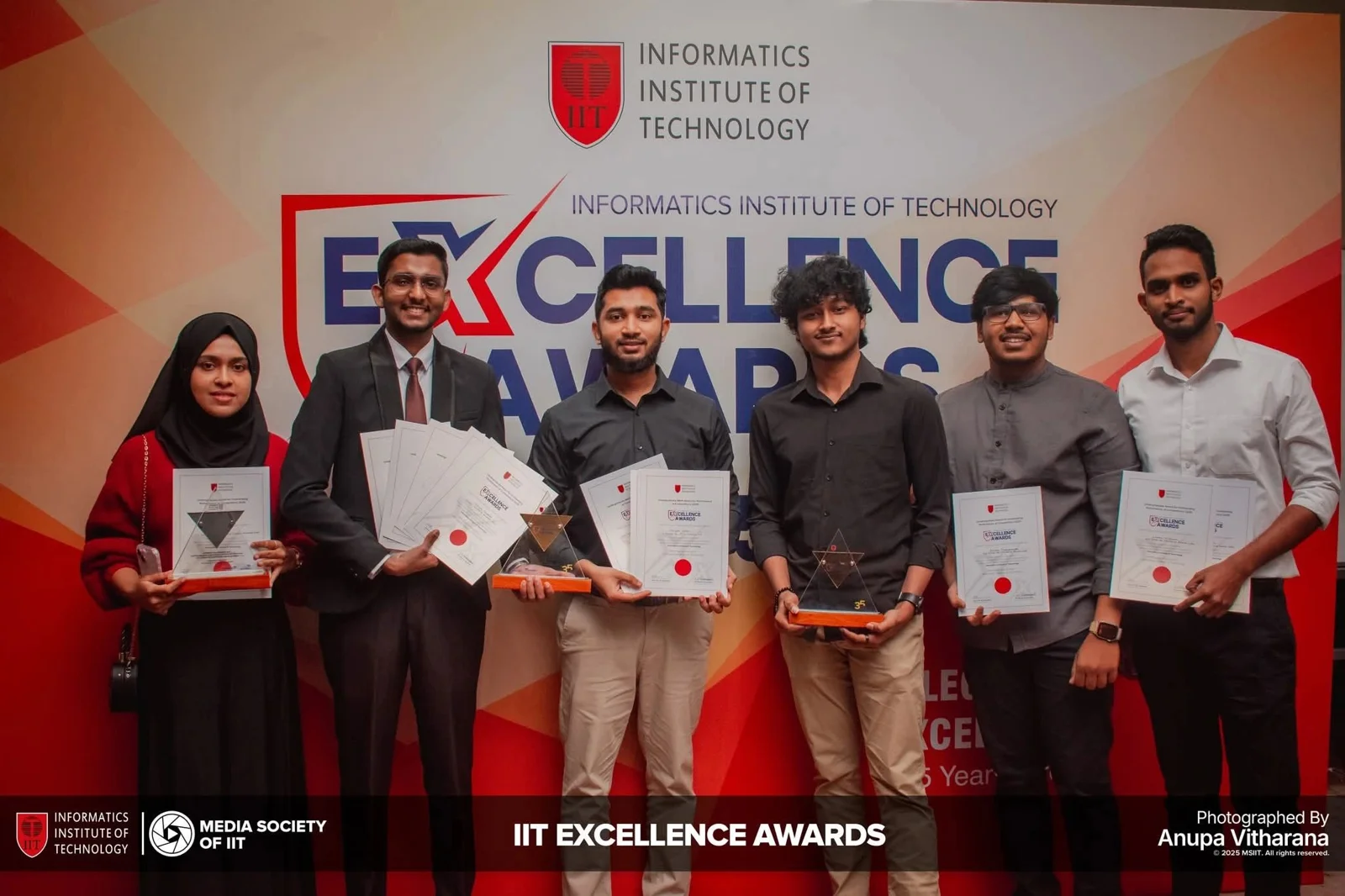 IIT Excellence Awards: attendees posing with certificates at the recognition event