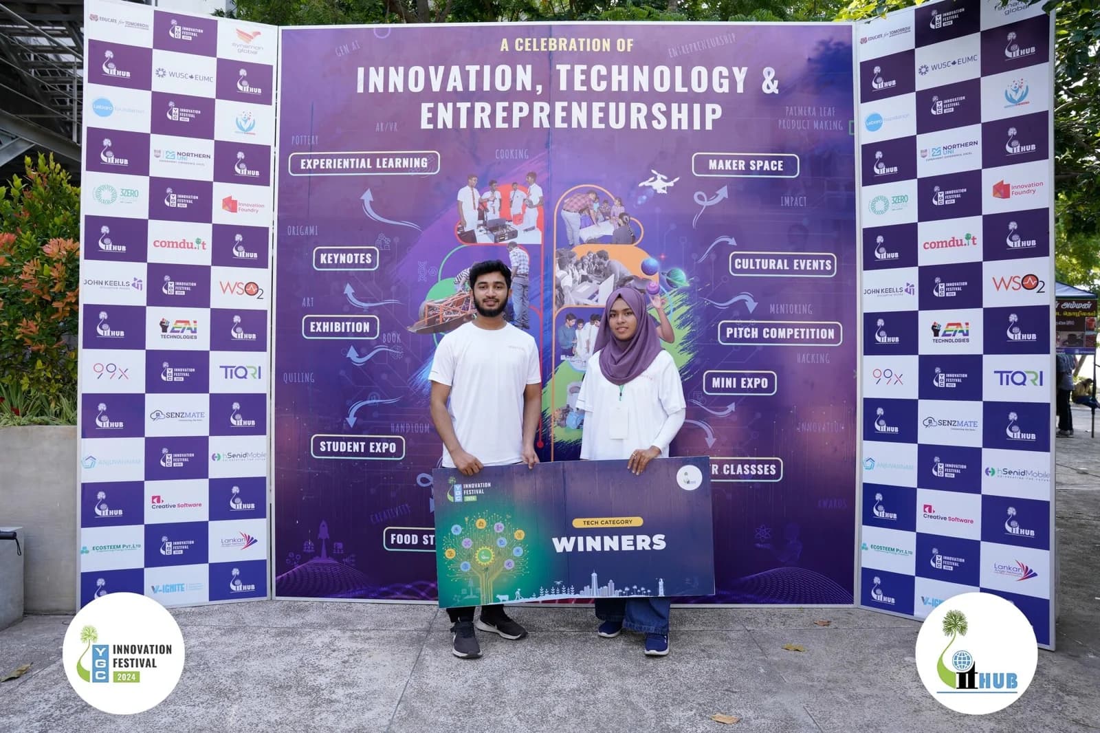 Yarl Geek Challenge: two team members holding the Tech category winners board